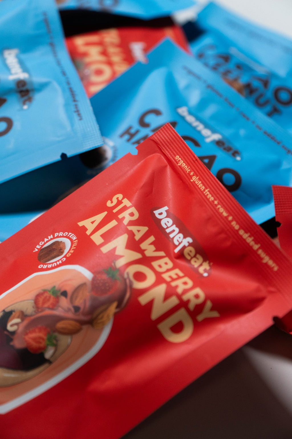 Strawberry Almond and Cacao Hazelnut packs piled together